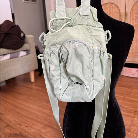 Calpak Handbags - Calpak Sage Green Floral water bottle bag